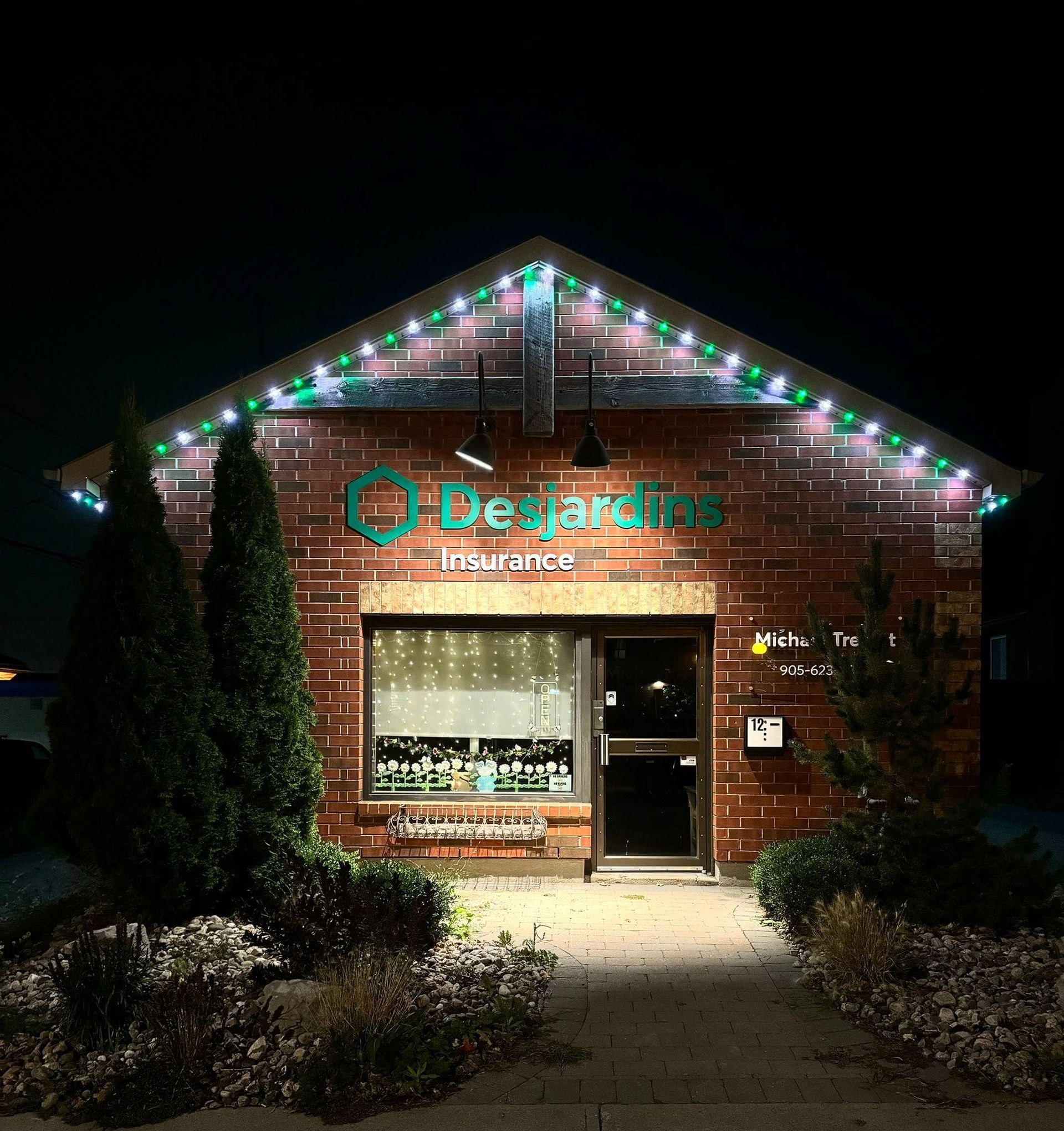 Desjardins Insurance building with custom green and white holiday lighting display