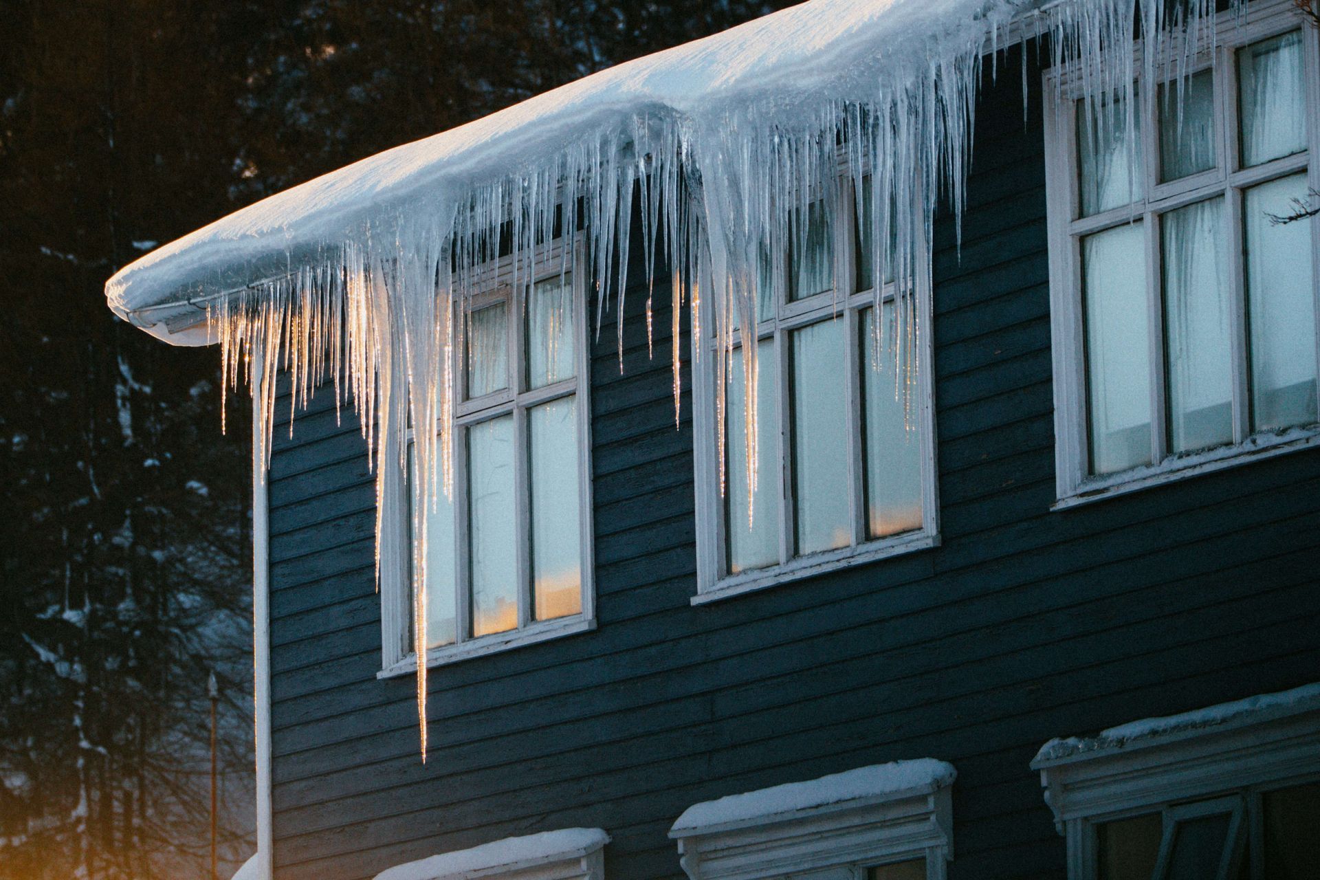 Ice dam formed on roof in the winter. Heat tape can prevent ice dam build up.