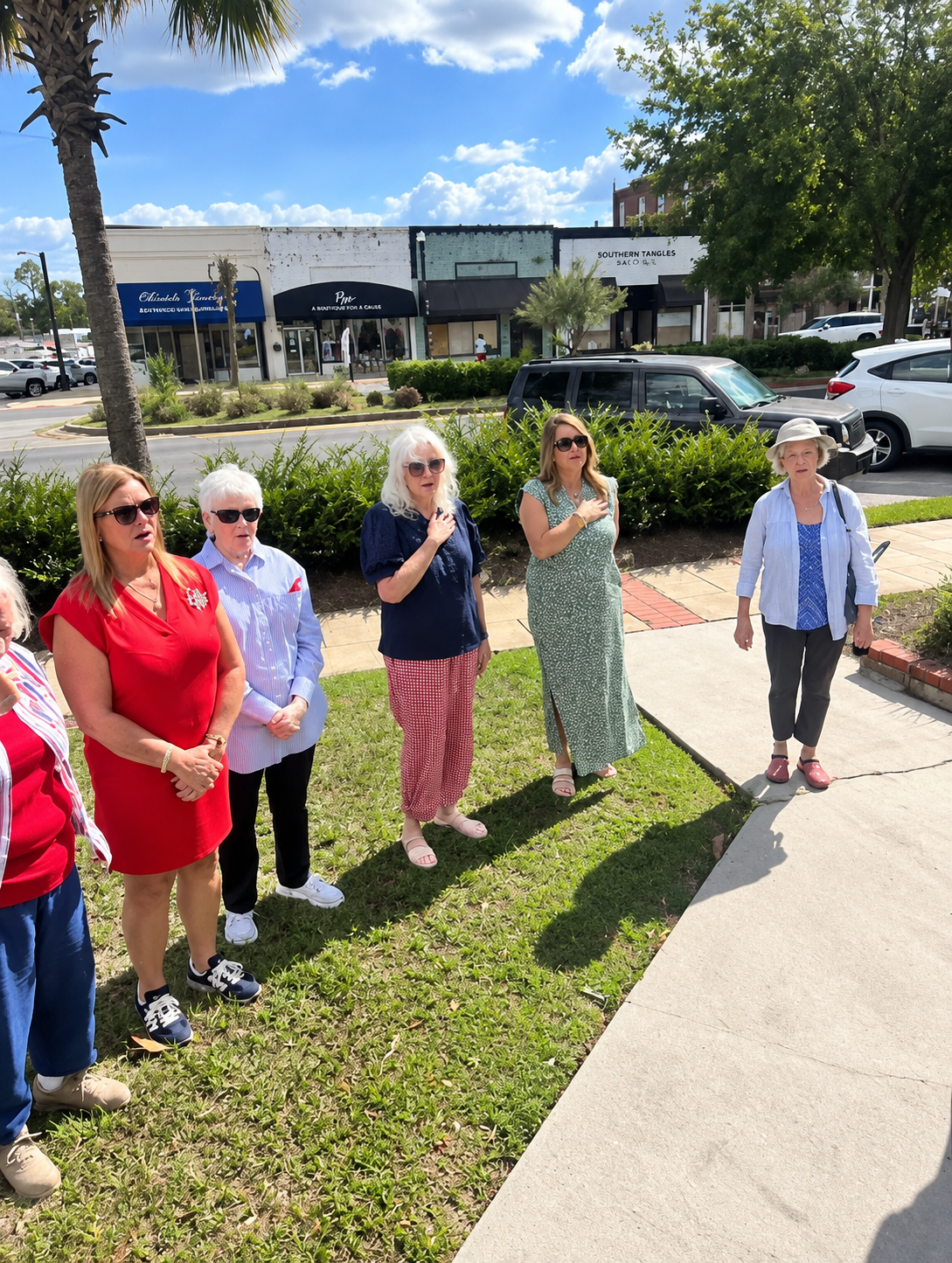 Community members standing together during Bells Across America ceremony