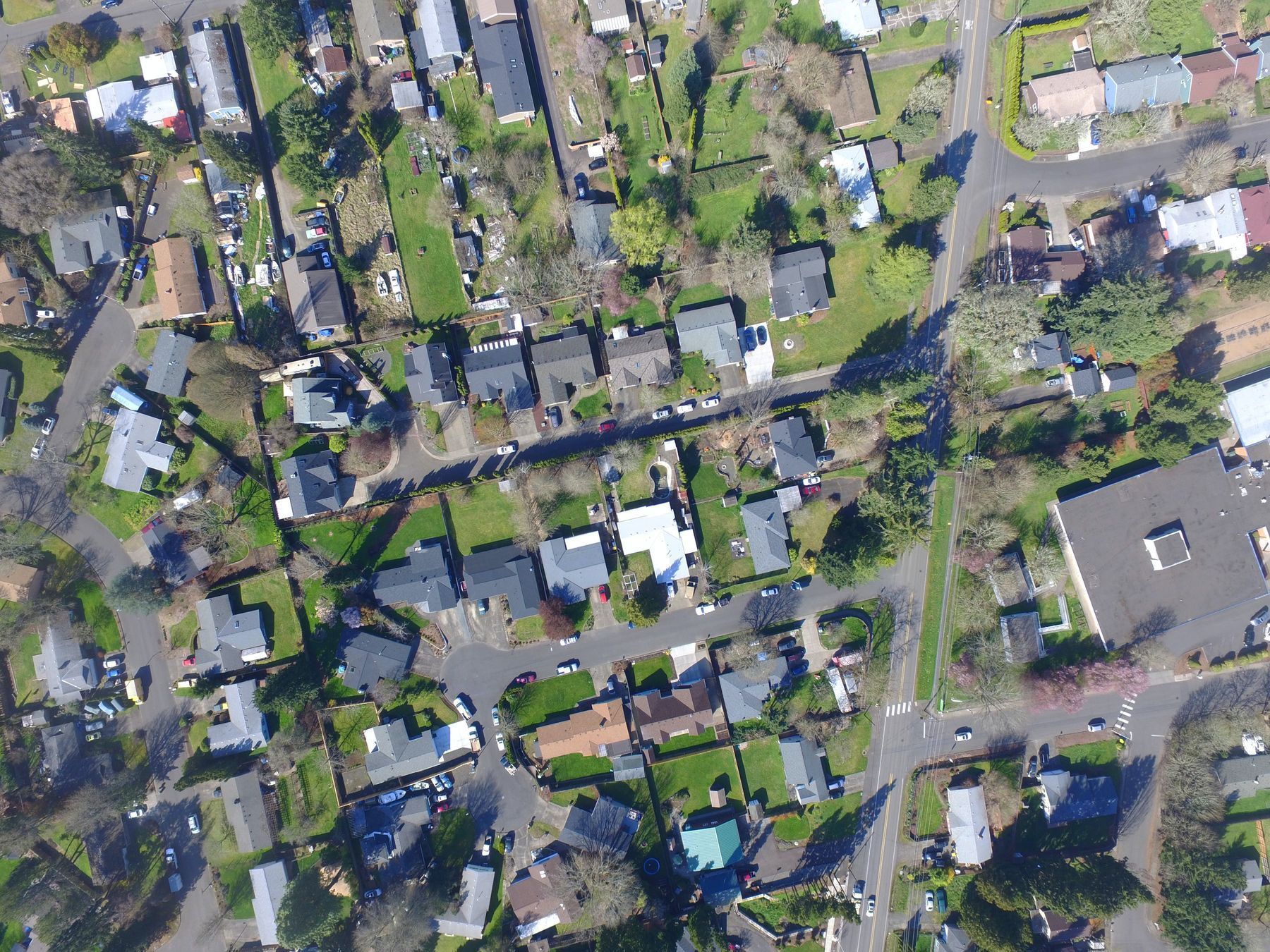 Aerial view of a residential community showing streets and houses as a connected pattern