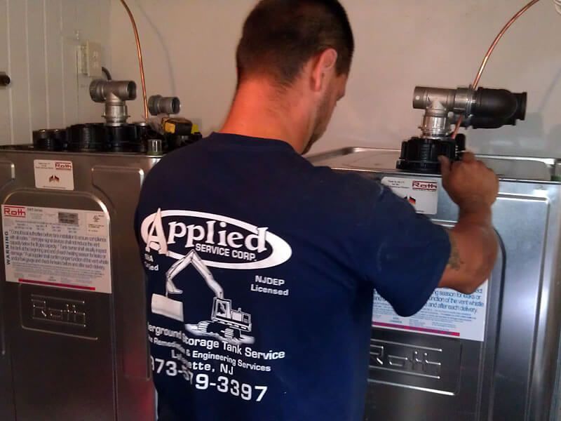 A person in a blue shirt with the logo