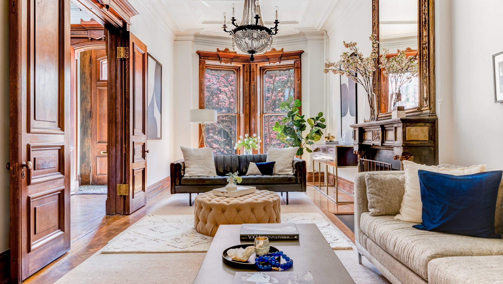 A living room filled with furniture and a chandelier.