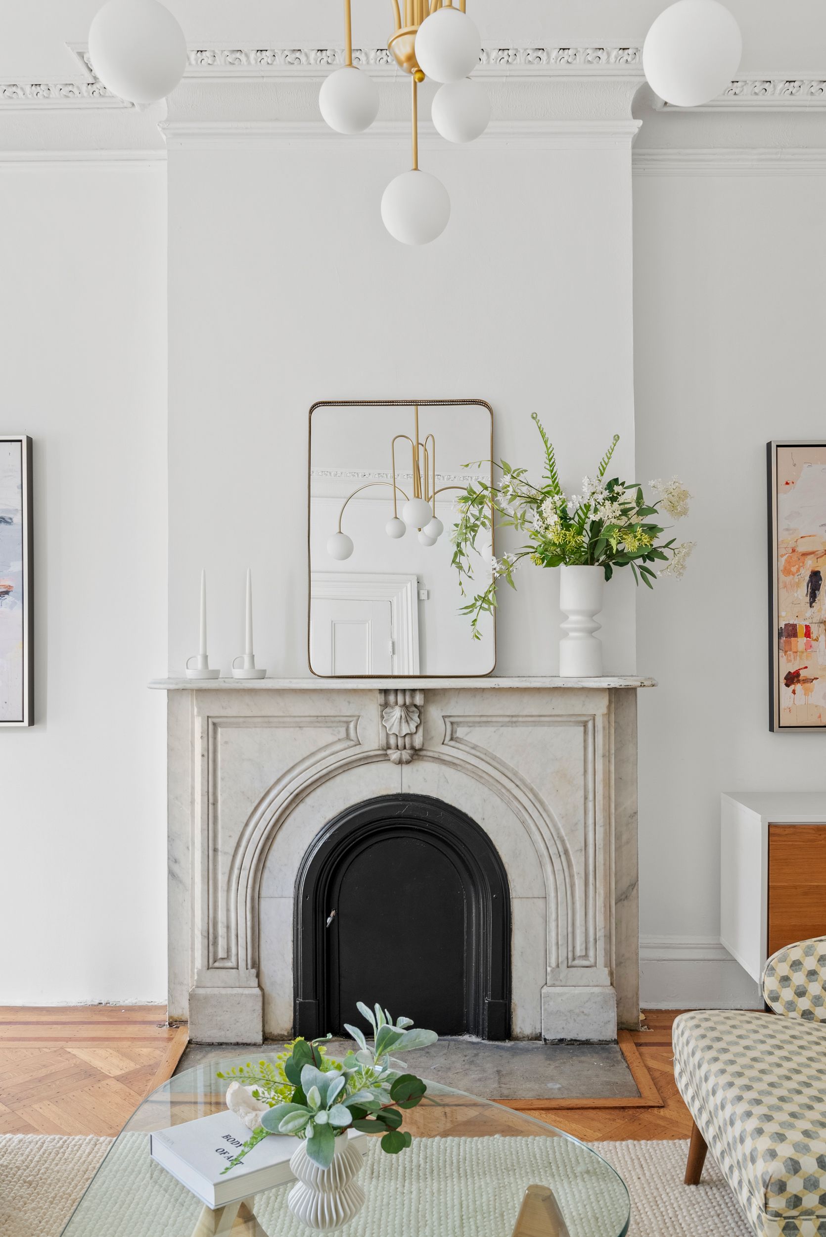 There is a fireplace in the middle of the living room.