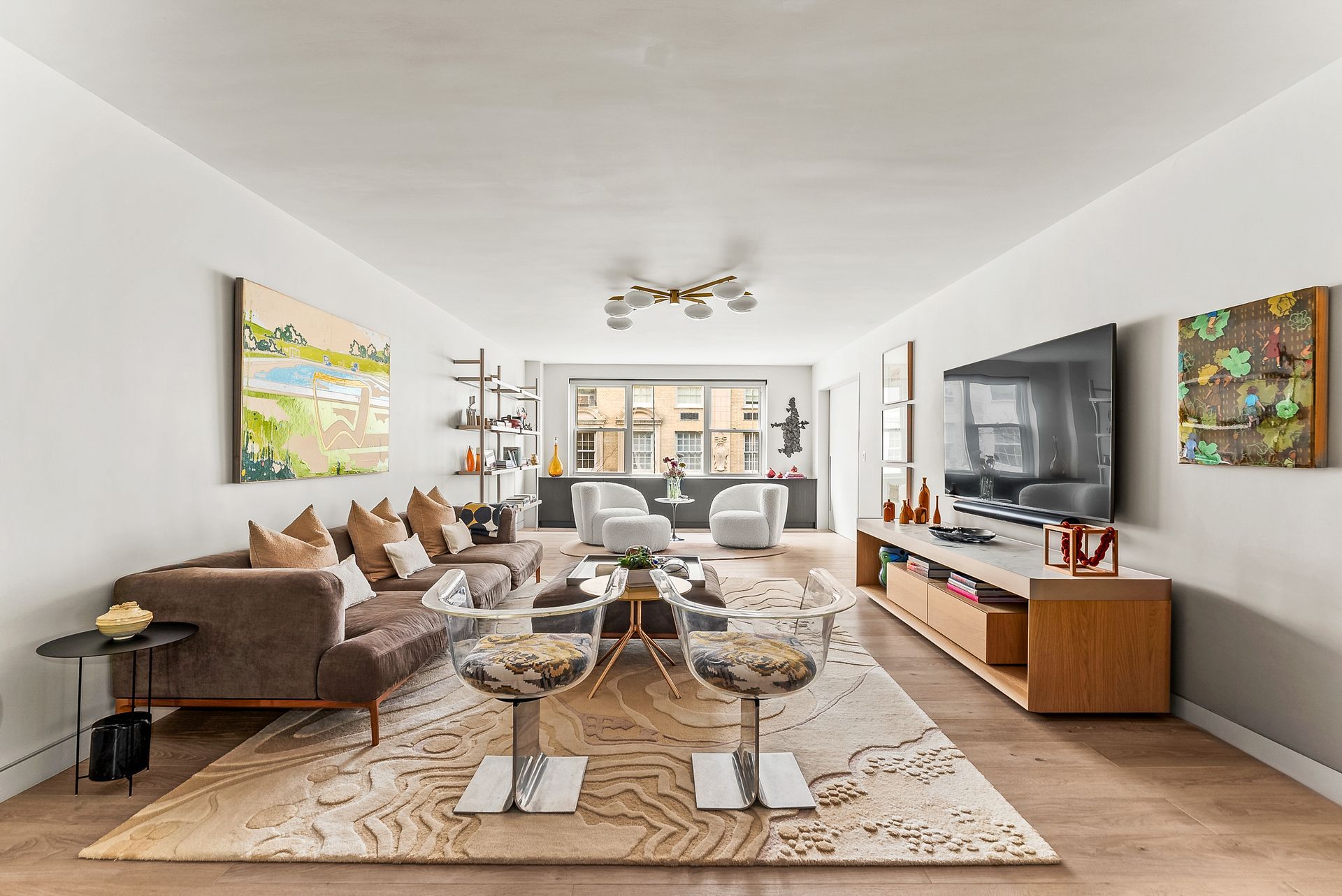 A living room filled with furniture and a flat screen tv.