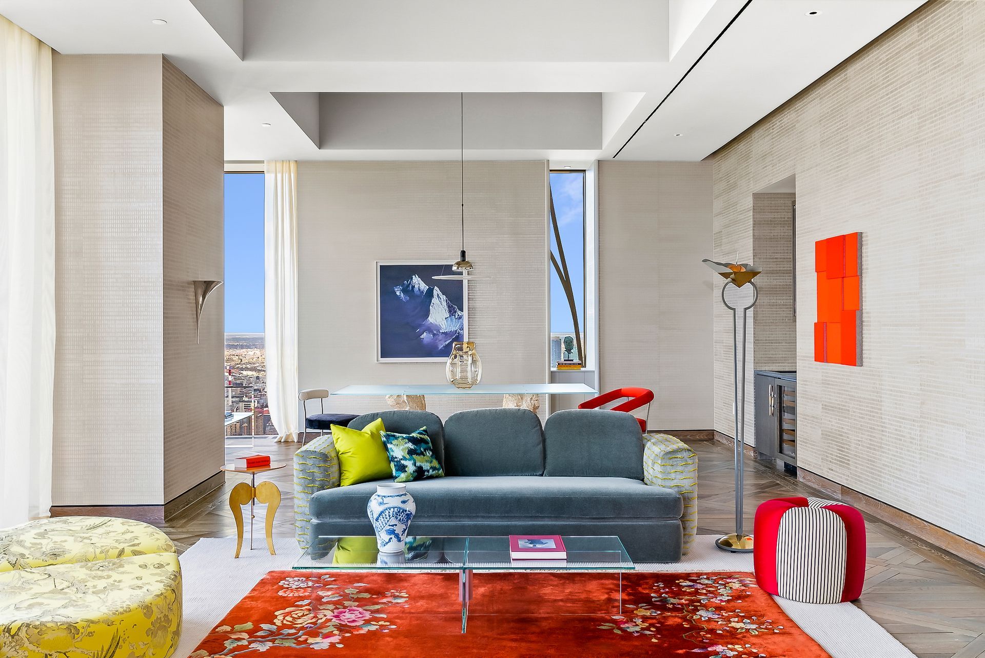 A living room with a couch , coffee table , and rug.