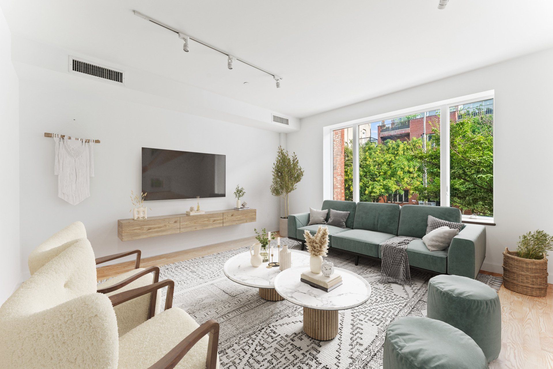 A living room with a couch , chairs , coffee table and television.