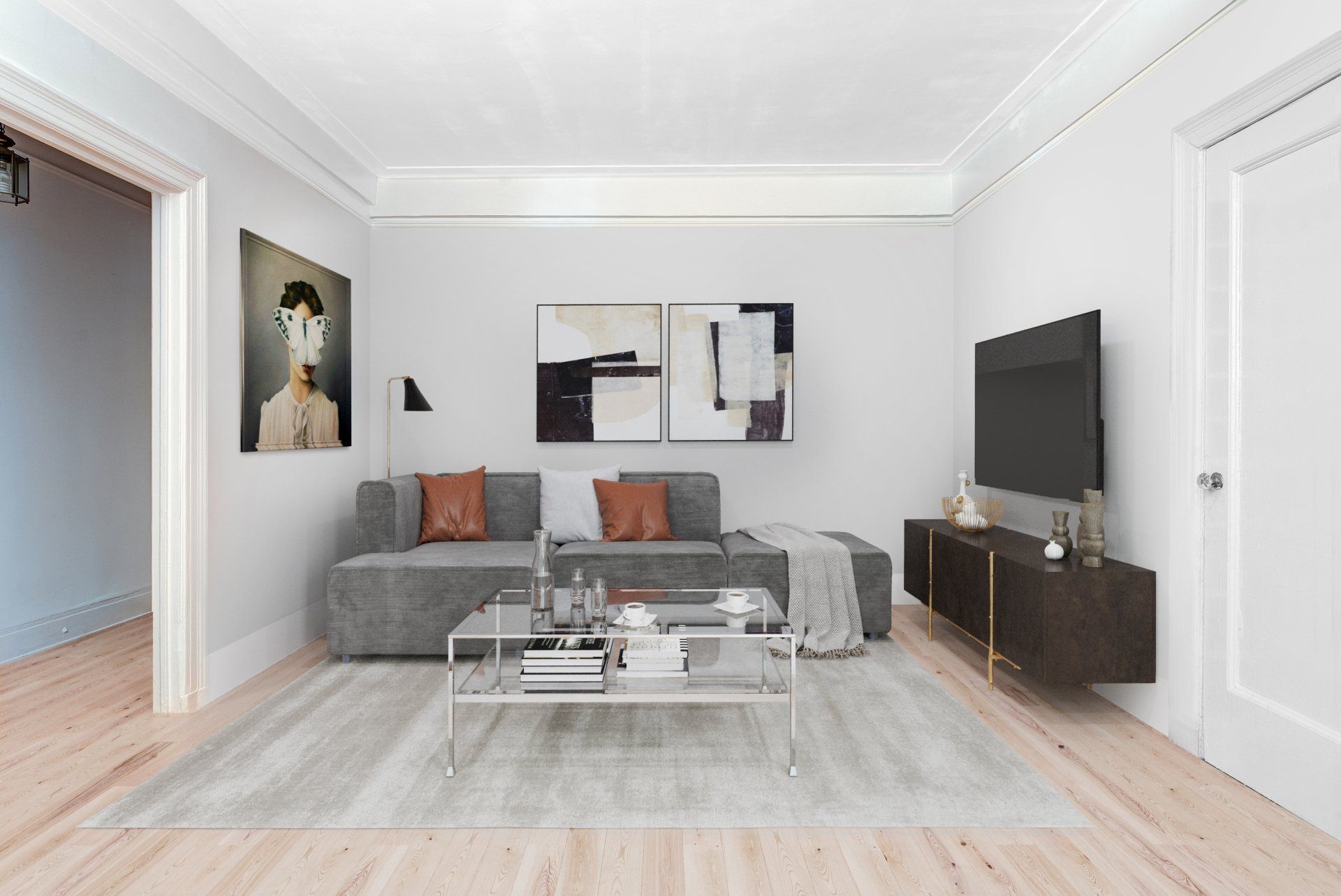 A living room with a couch , coffee table , and television.