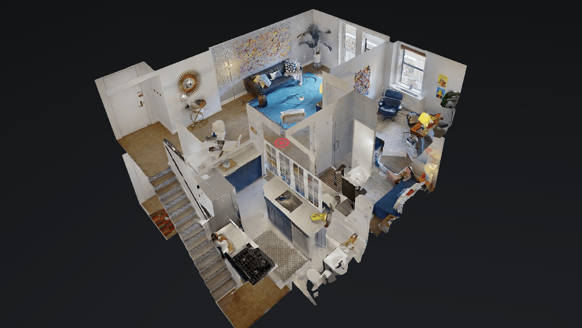 An aerial view of a house with a bedroom , living room , and kitchen.