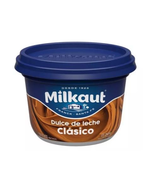 Tarrina azul de Milkaut Dulce de Leche Clásico, un untable color caramelo, con tapa y marca en color azul.