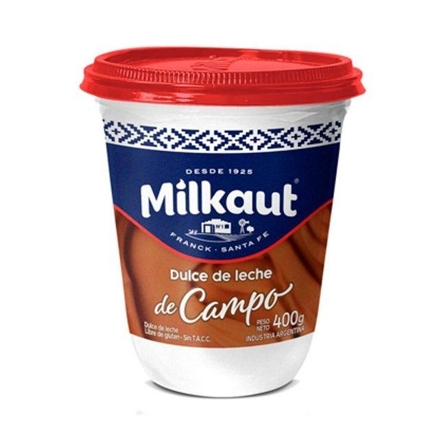 Envase de dulce de leche “Milkaur”, etiqueta blanca y azul con tapa roja.
