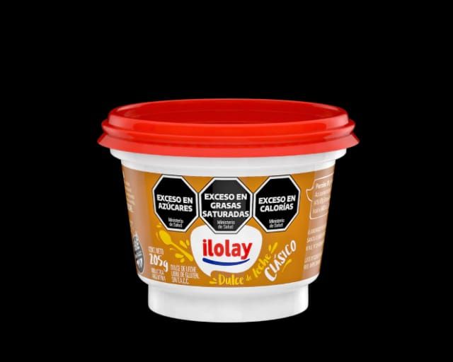 Envase de crema láctea Ilolay Classico con tapa roja y advertencias sanitarias.
