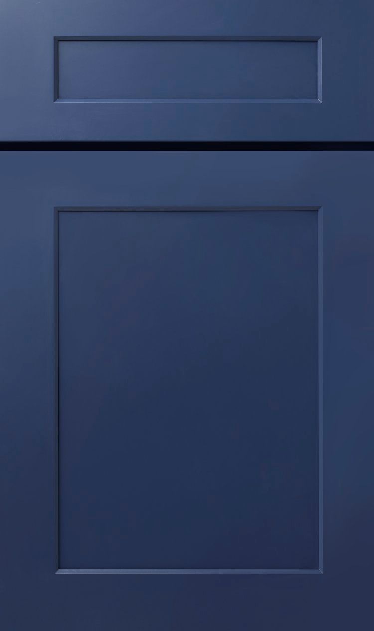 Blue cabinet door with a small top drawer and a larger lower panel
