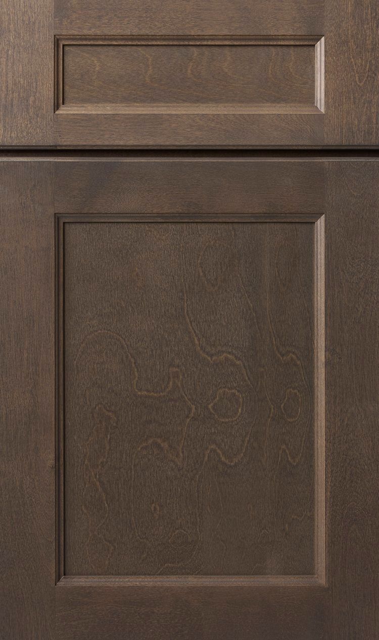 Brown cabinet doors with raised panels and silver handles.
