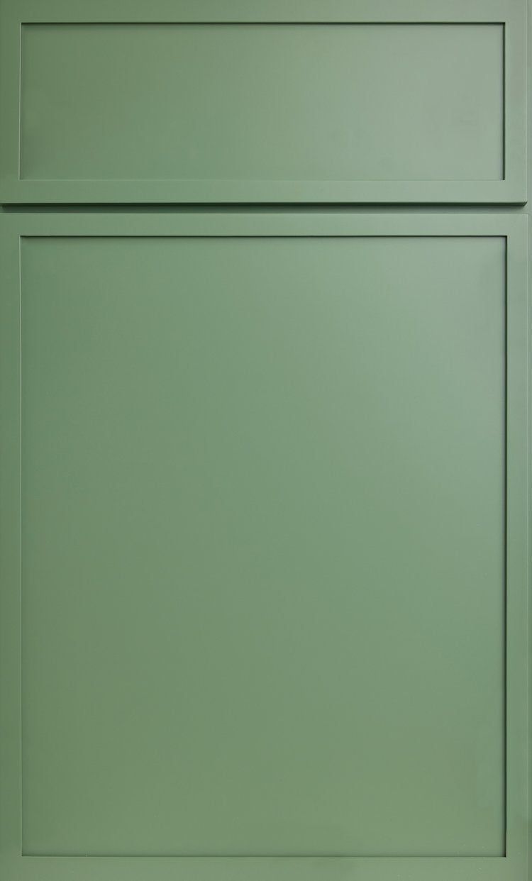 Green paneled cabinet door with a small upper panel and larger lower panel