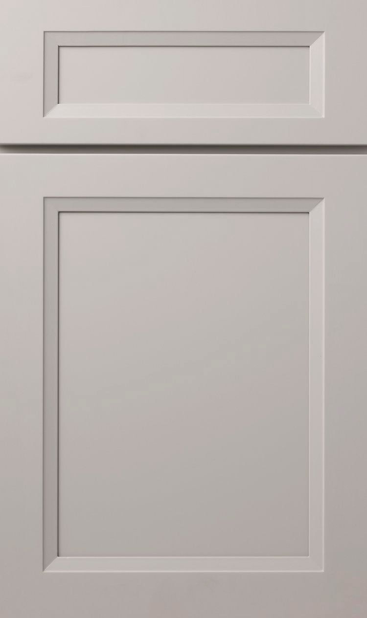 White paneled cabinet door with a recessed top drawer and larger lower panel