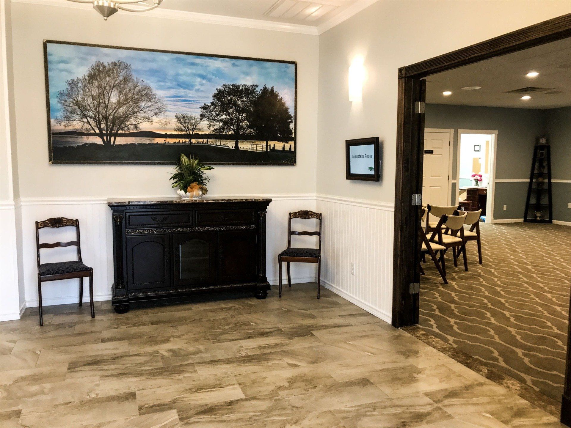 funeral home facility grand foyer with black cabinet