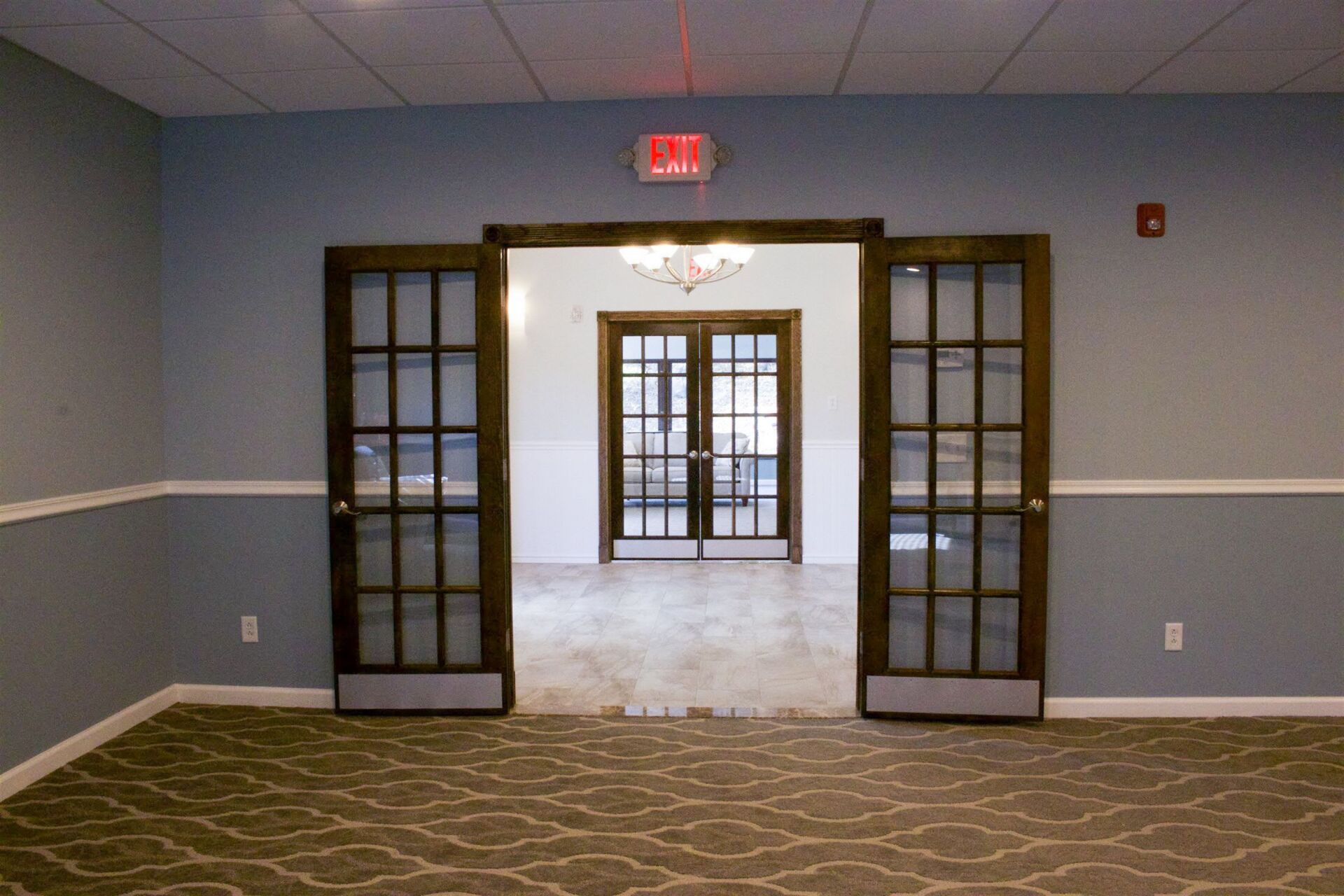 funeral home facility mountain room with open exit door