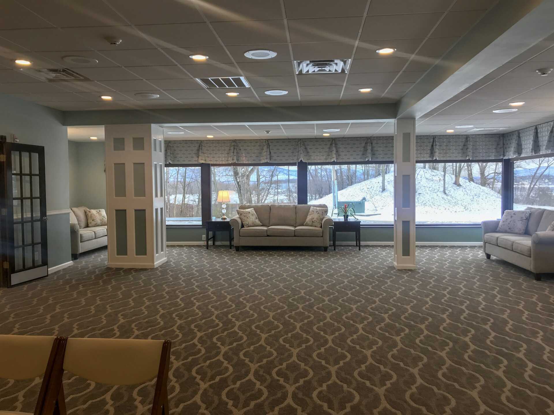 funeral home facility room with couch at the far end