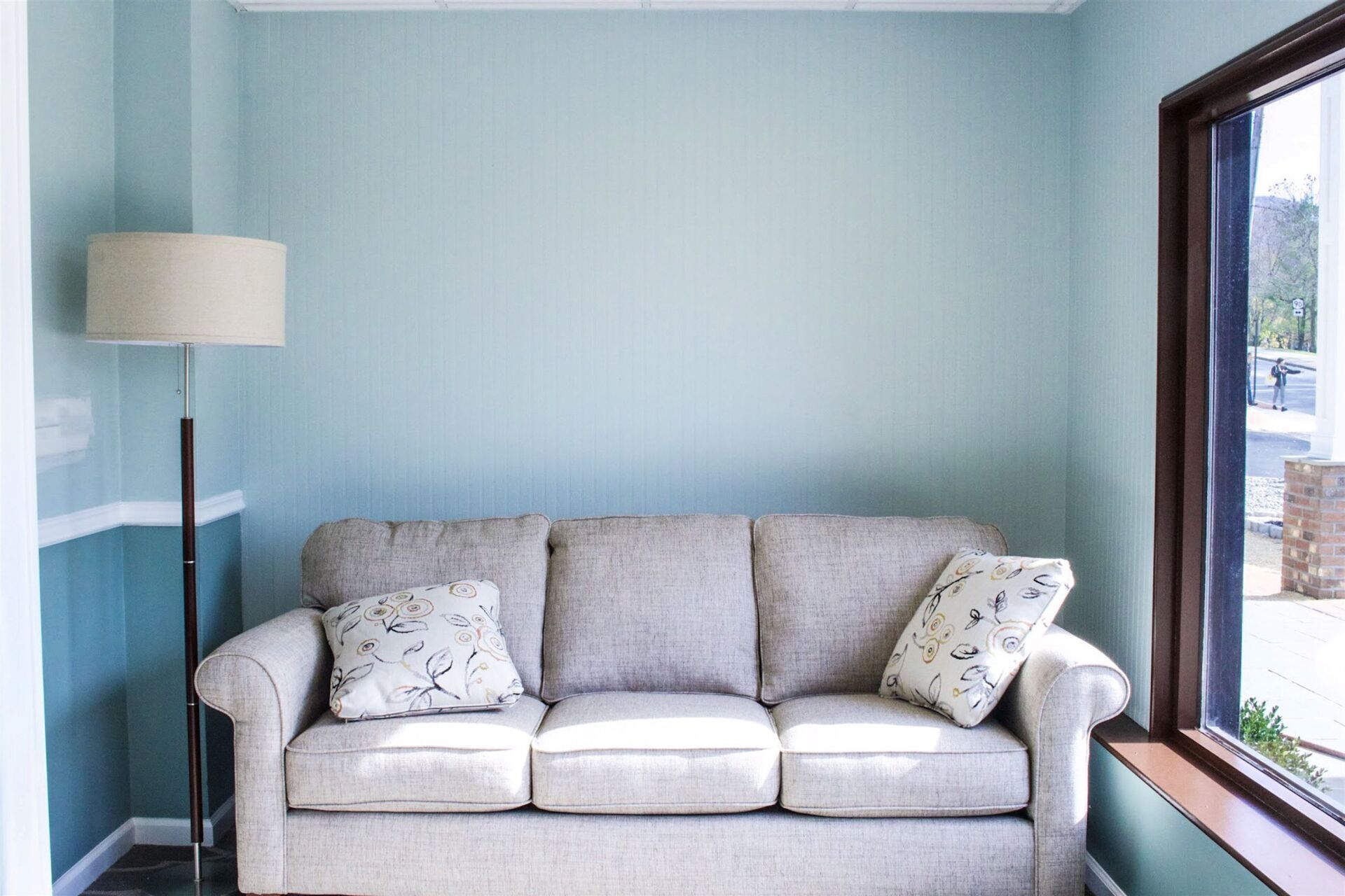 funeral home facility room with a big with white couch