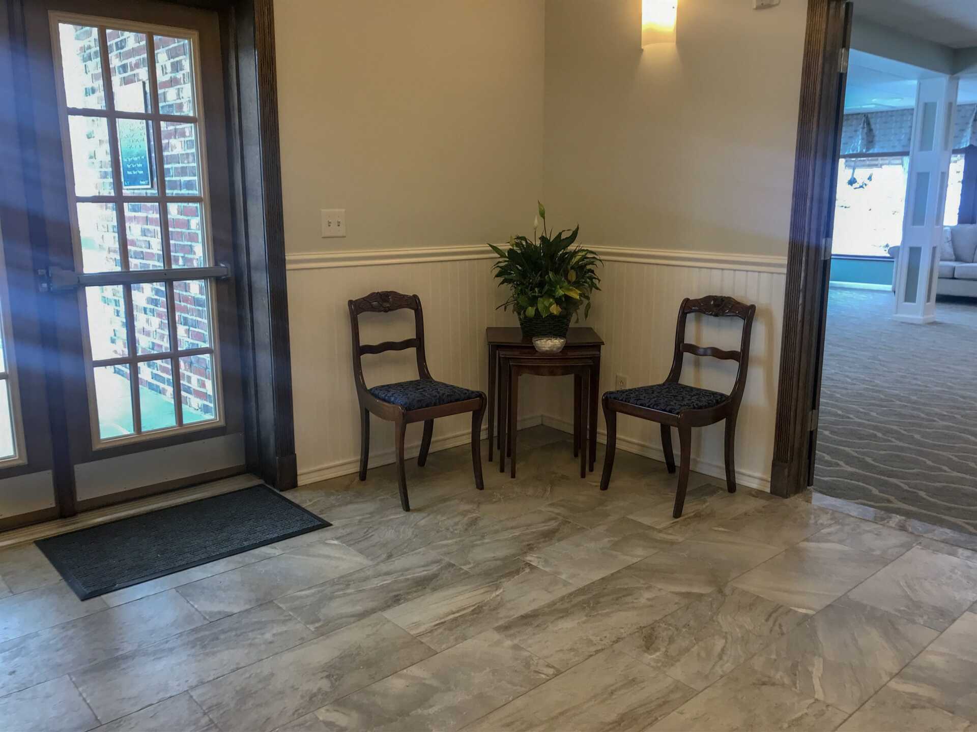 funeral home facility grand foyer with two chairs