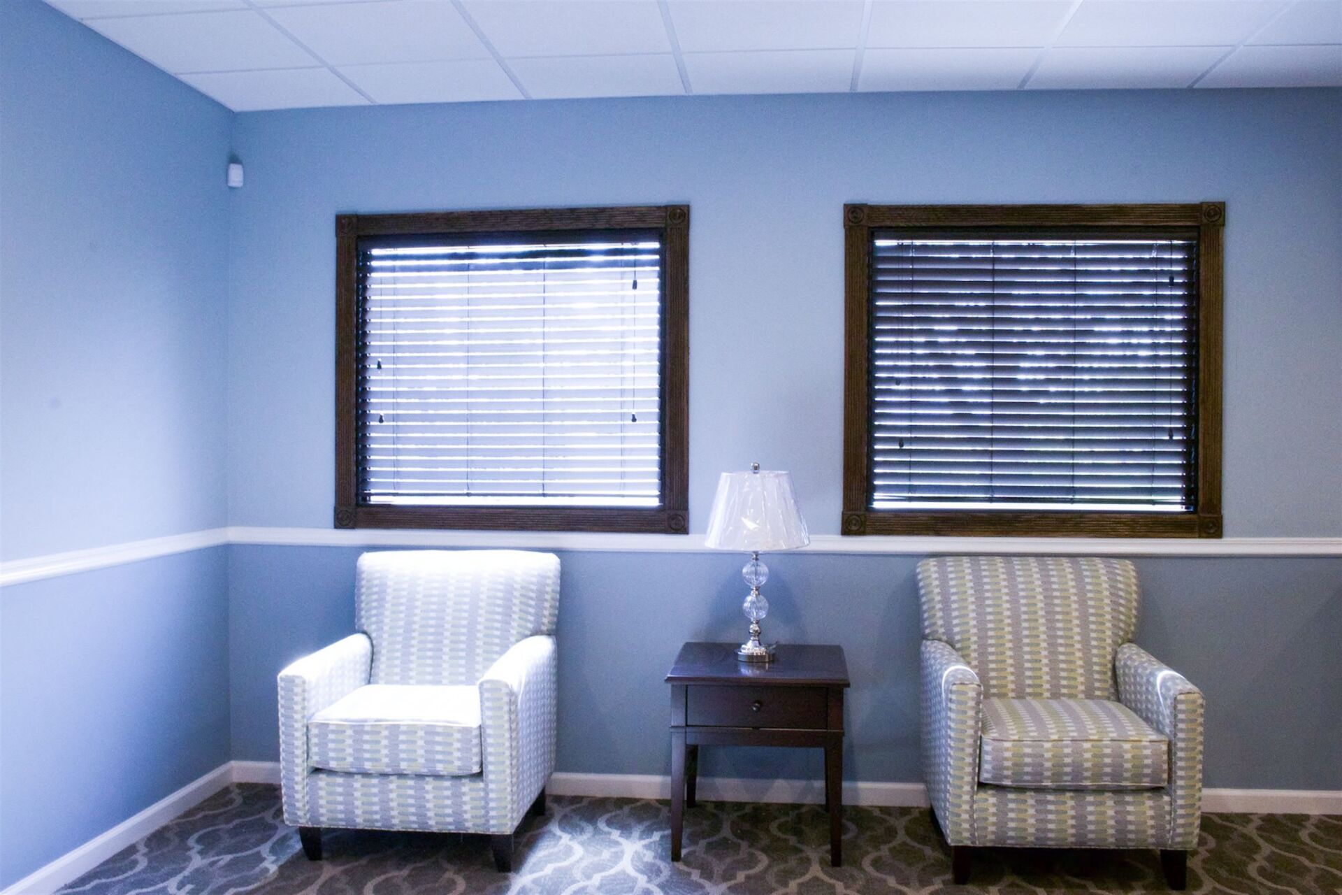 funeral home facility mountain room with two windows and two chairs