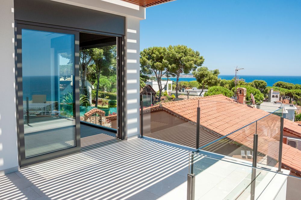 There is a Balcony With a View of the Ocean — Whitsunday Architectural Windows & Doors in Cannonvale, QLD
