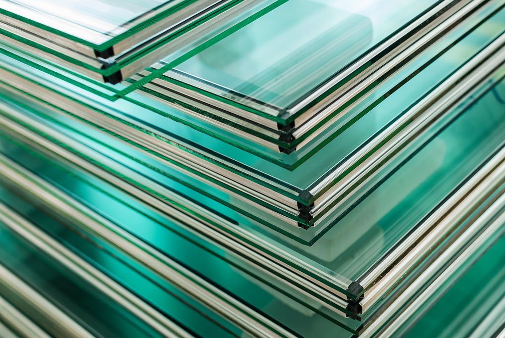 A Stack of Glass Sheets Stacked on Top of Each Other — Whitsunday Architectural Windows & Doors in Proserpine, QLD