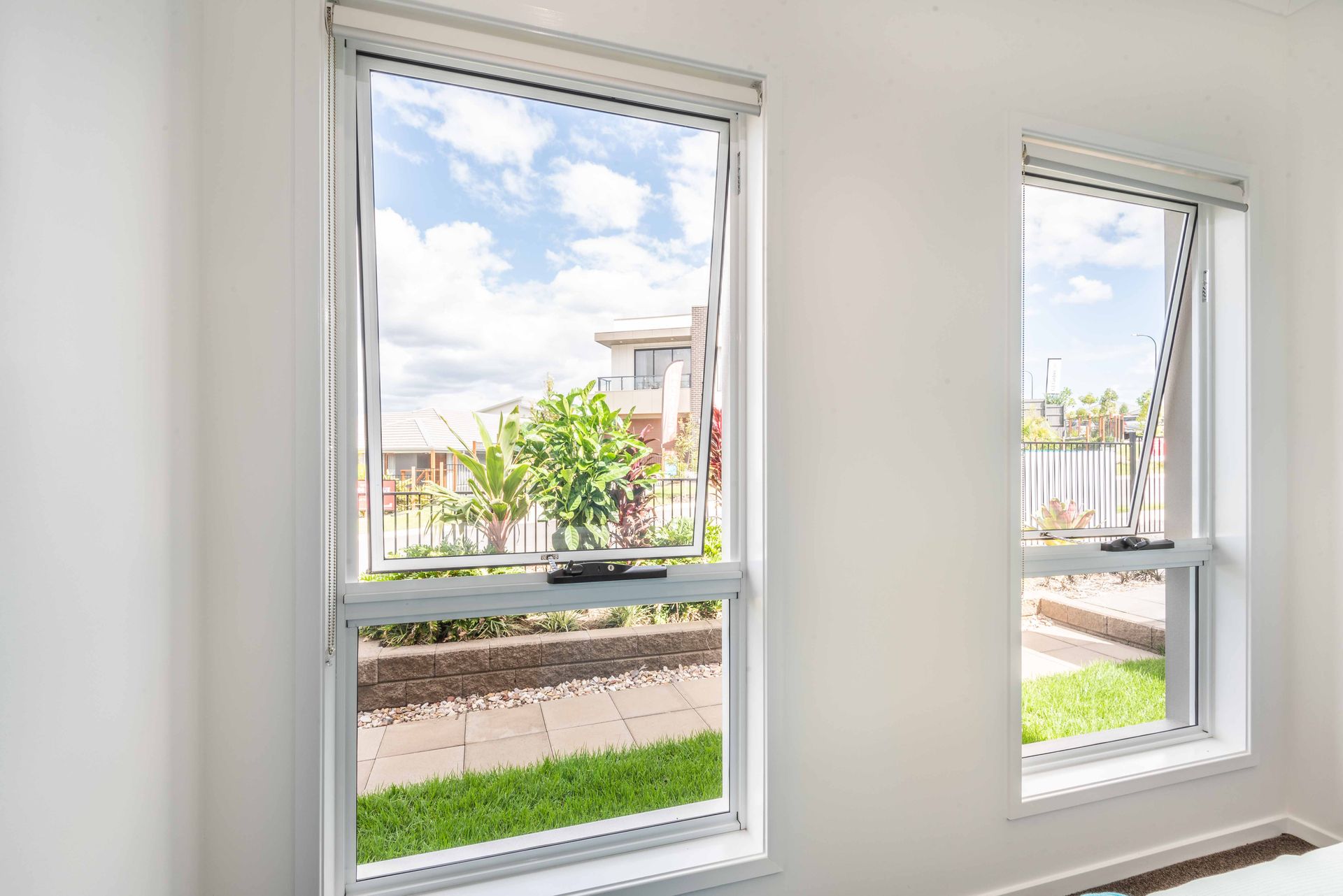 A View of a City Skyline Through an Open Window — Whitsunday Architectural Windows & Doors in Proserpine, QLD