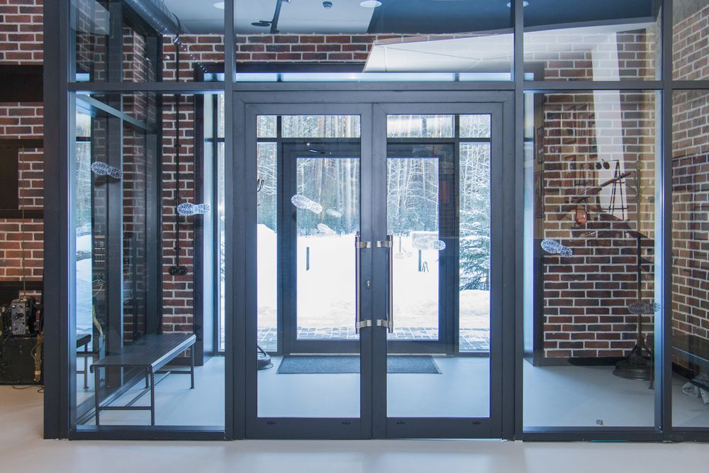 A Room With a Lot of Windows and a Brick Wall — Whitsunday Architectural Windows & Doors in Proserpine, QLD