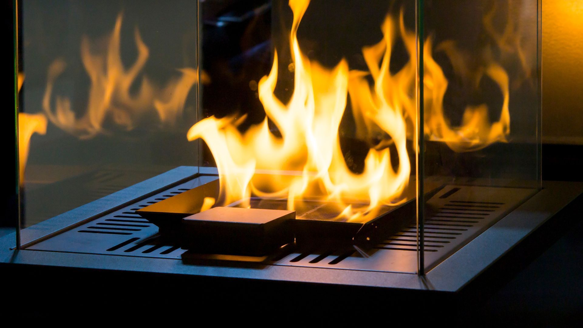 A fireplace with a lot of flames coming out of it