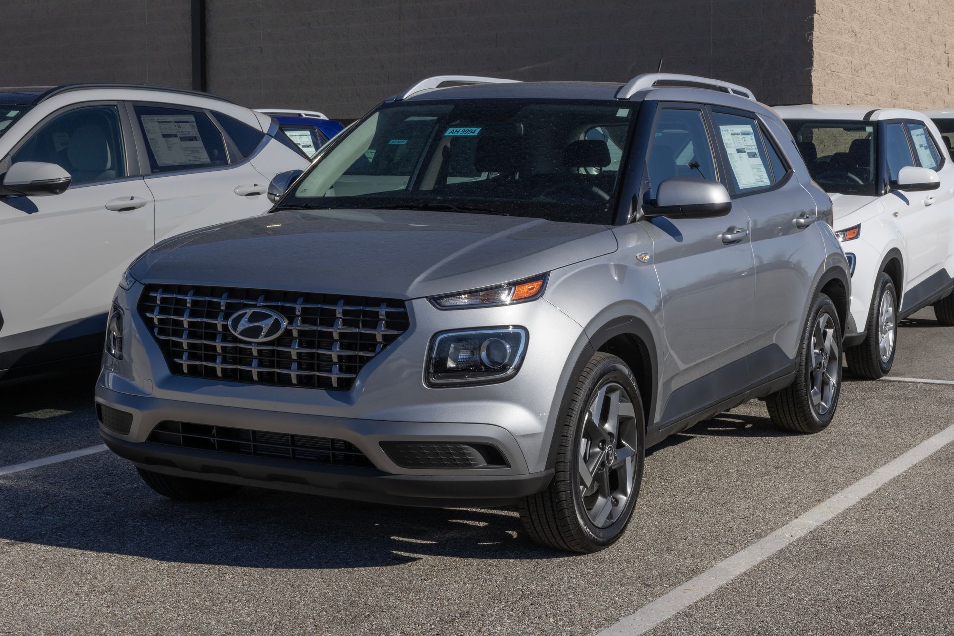 Silver Hyundai SUV parked in a lot, viewed from the front-left side.