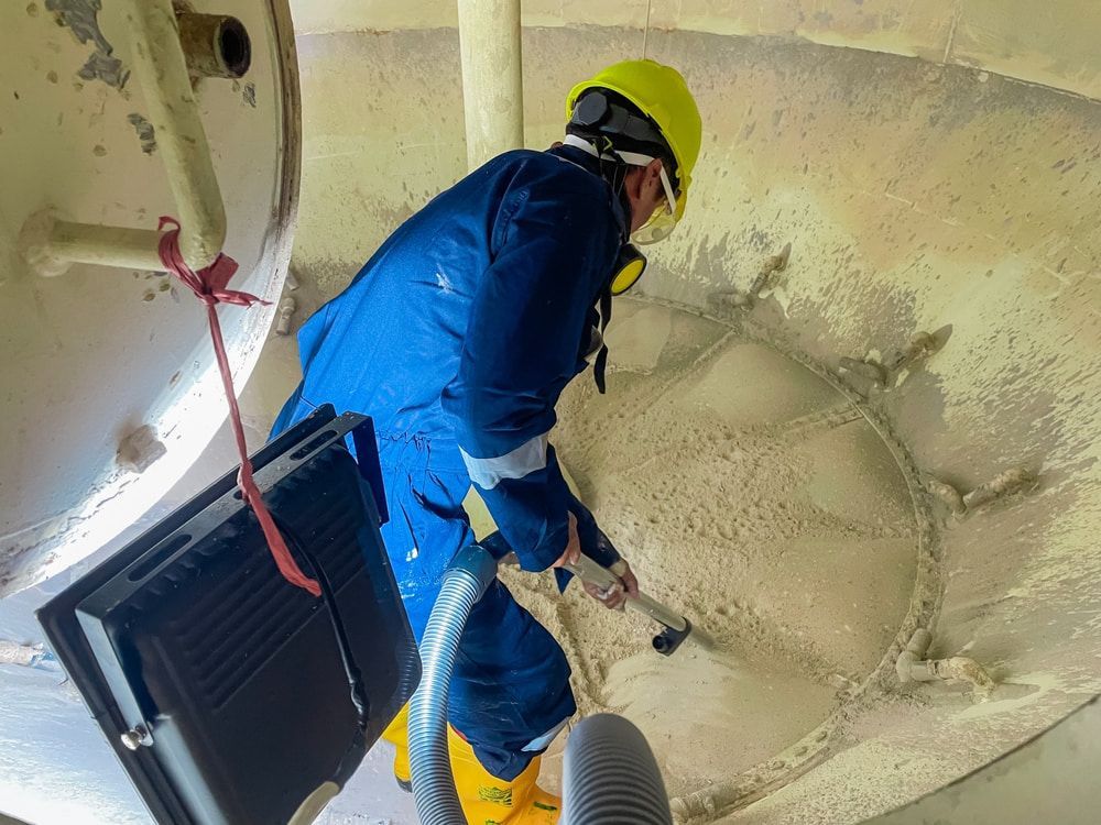 Industrial washing big barrel with water— Providing Industrial Tank Cleaning in the Northern Territory