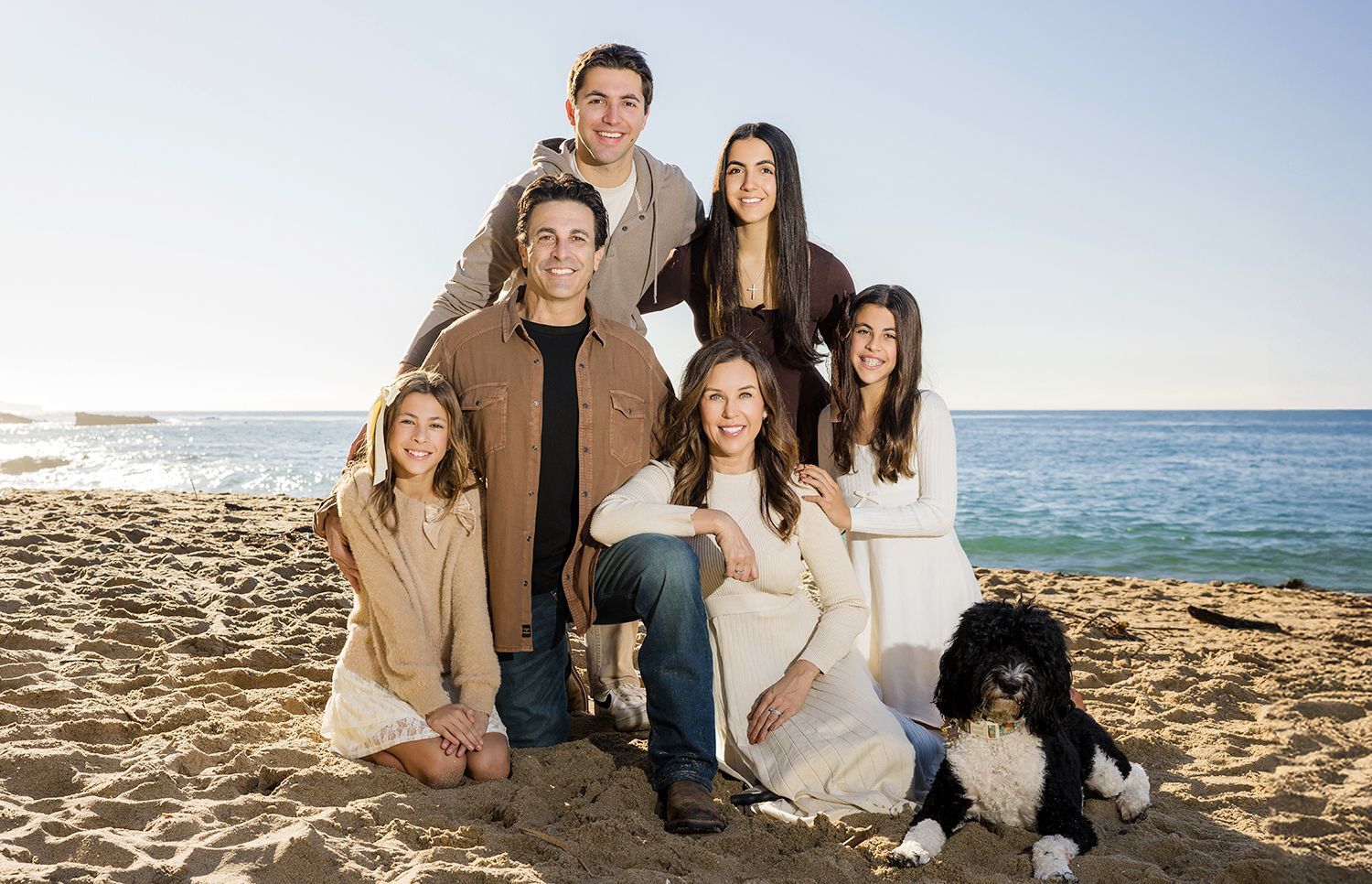 A family of six with their dog at Main Beach, Laguna Beach