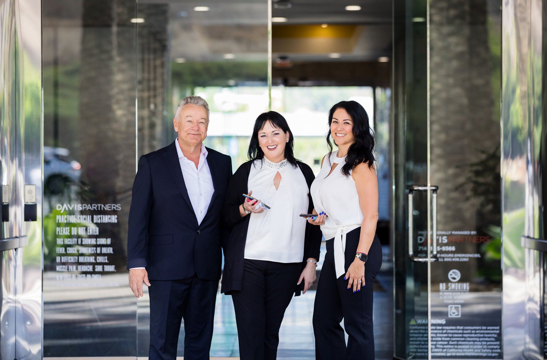 Accounting firm partners photographed in a building lobby