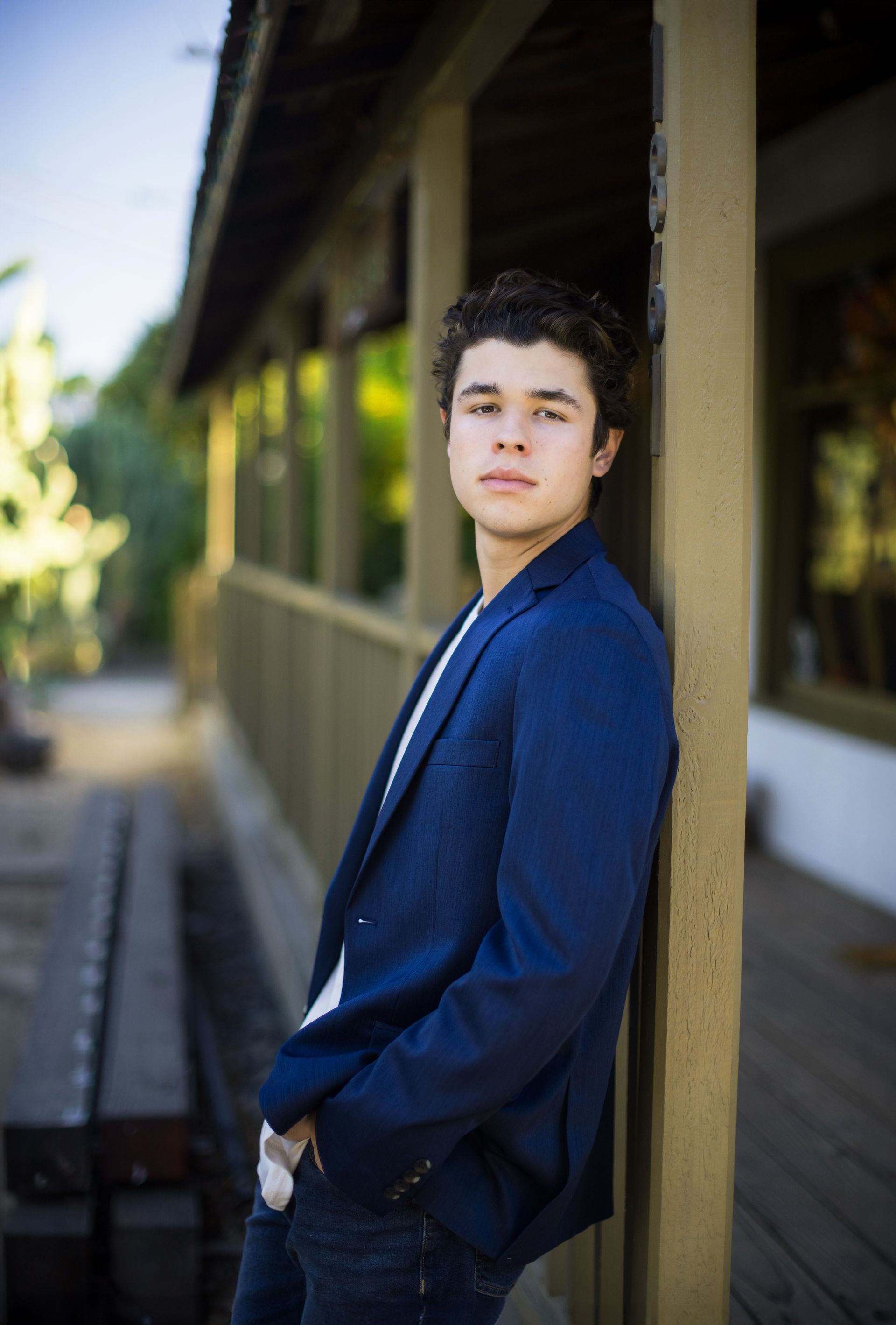 Senior guy leaning by the train depot in San Juan Capistrano