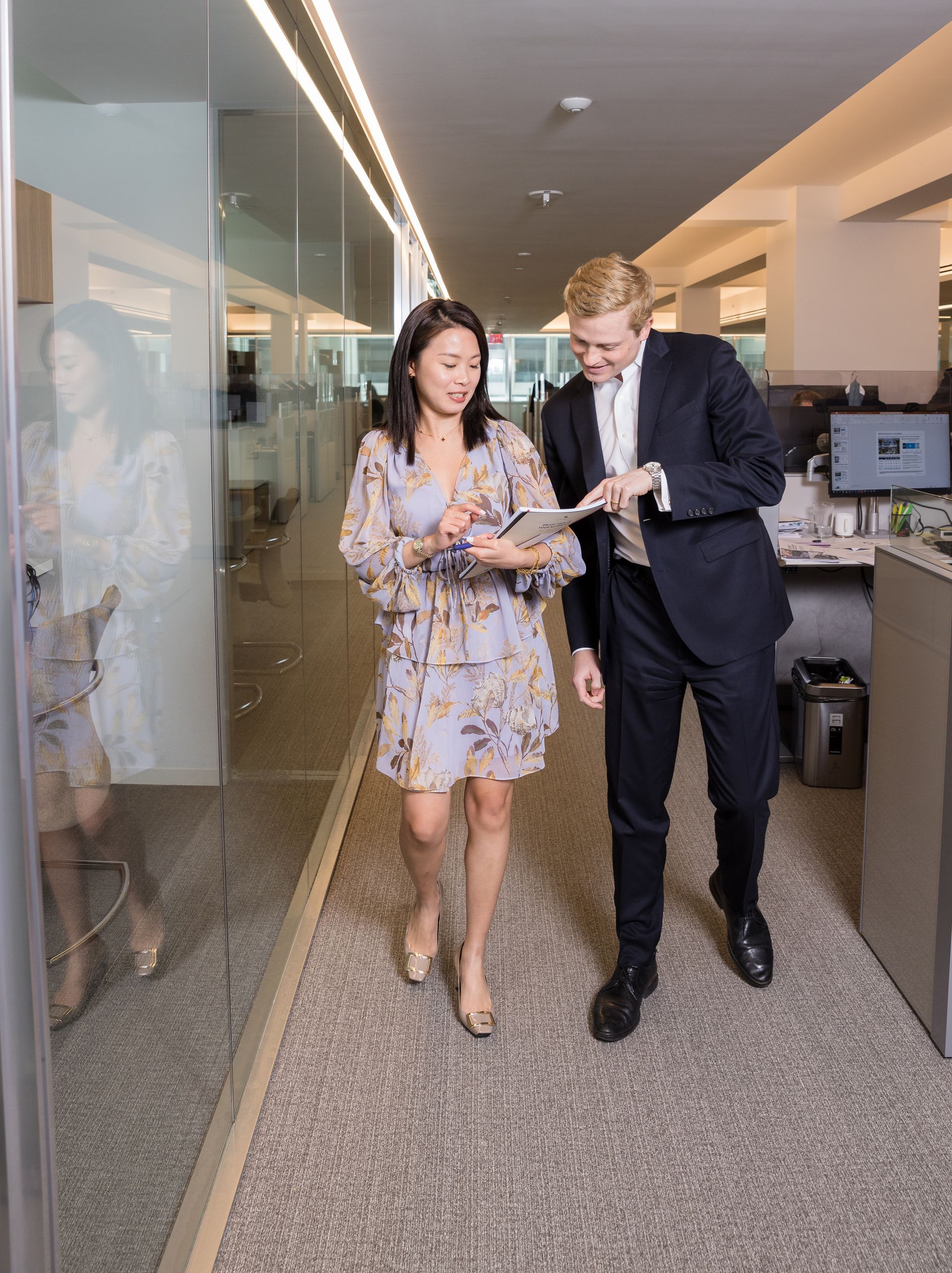 Corporate culture photoshoot of colleagues walking through a modern office
