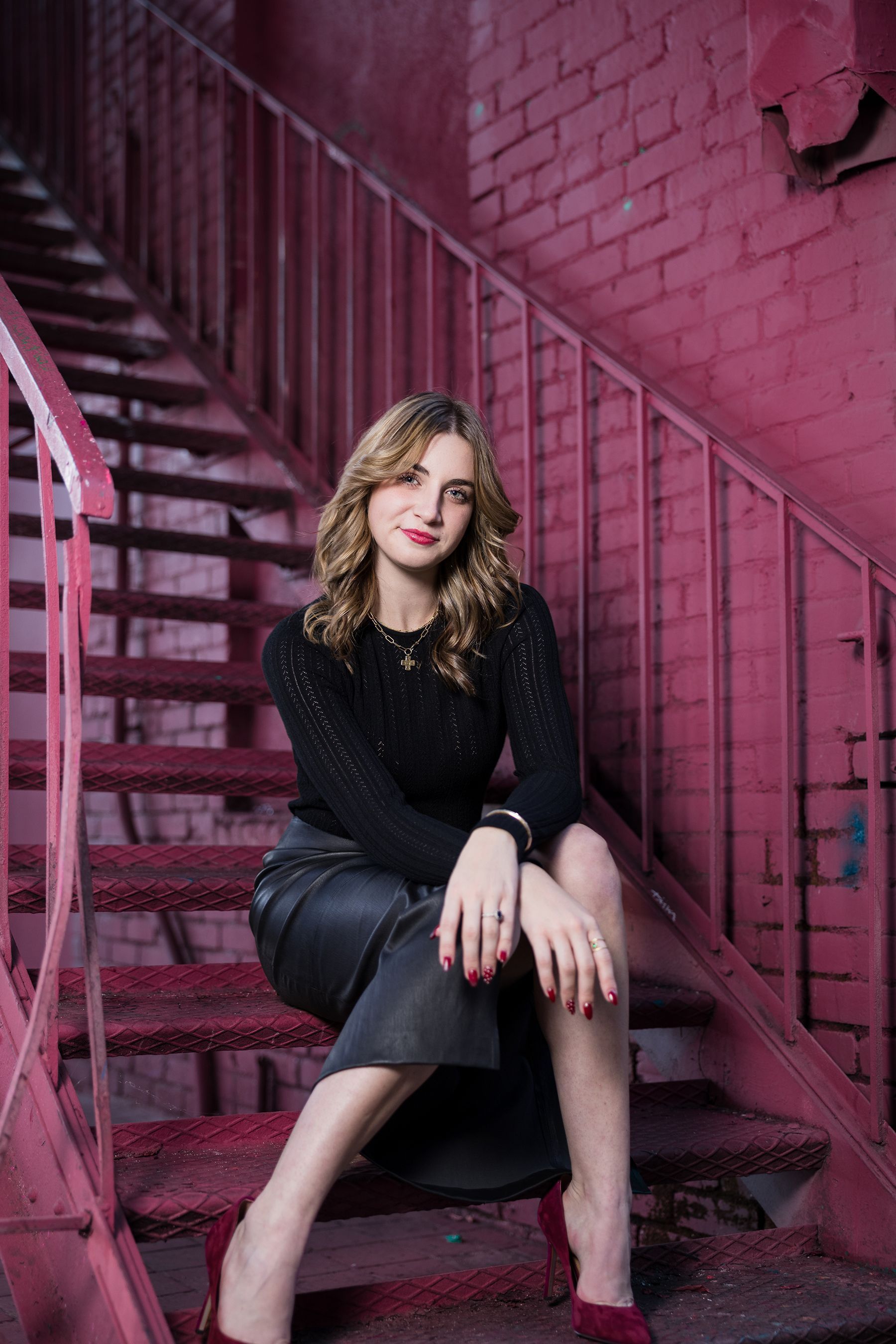 Senior portrait of a girl in the Santa Ana Art District featuring urban street art.