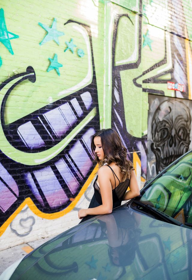 Senior girl by a graffiti wall, Orange County