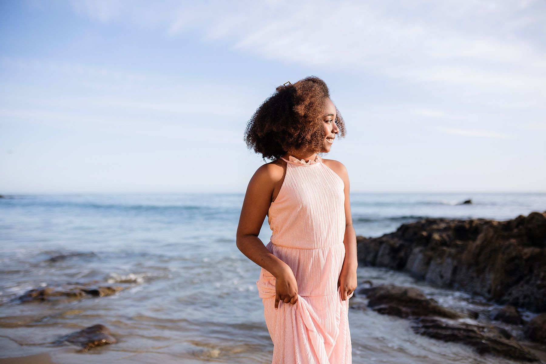 Childr photographed on the beach at Montage, Laguna Beach in a pink dress