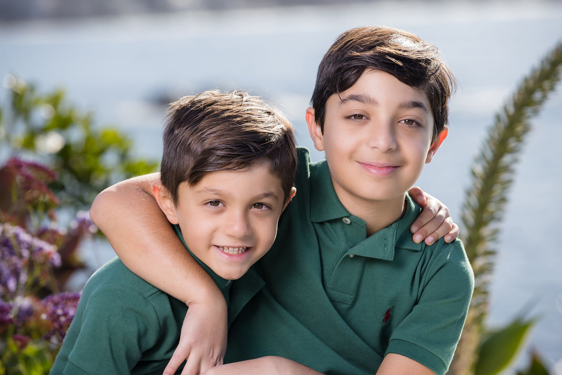Custom wall art created from Laguna Beach family session of brothers hugging in front of the ocean