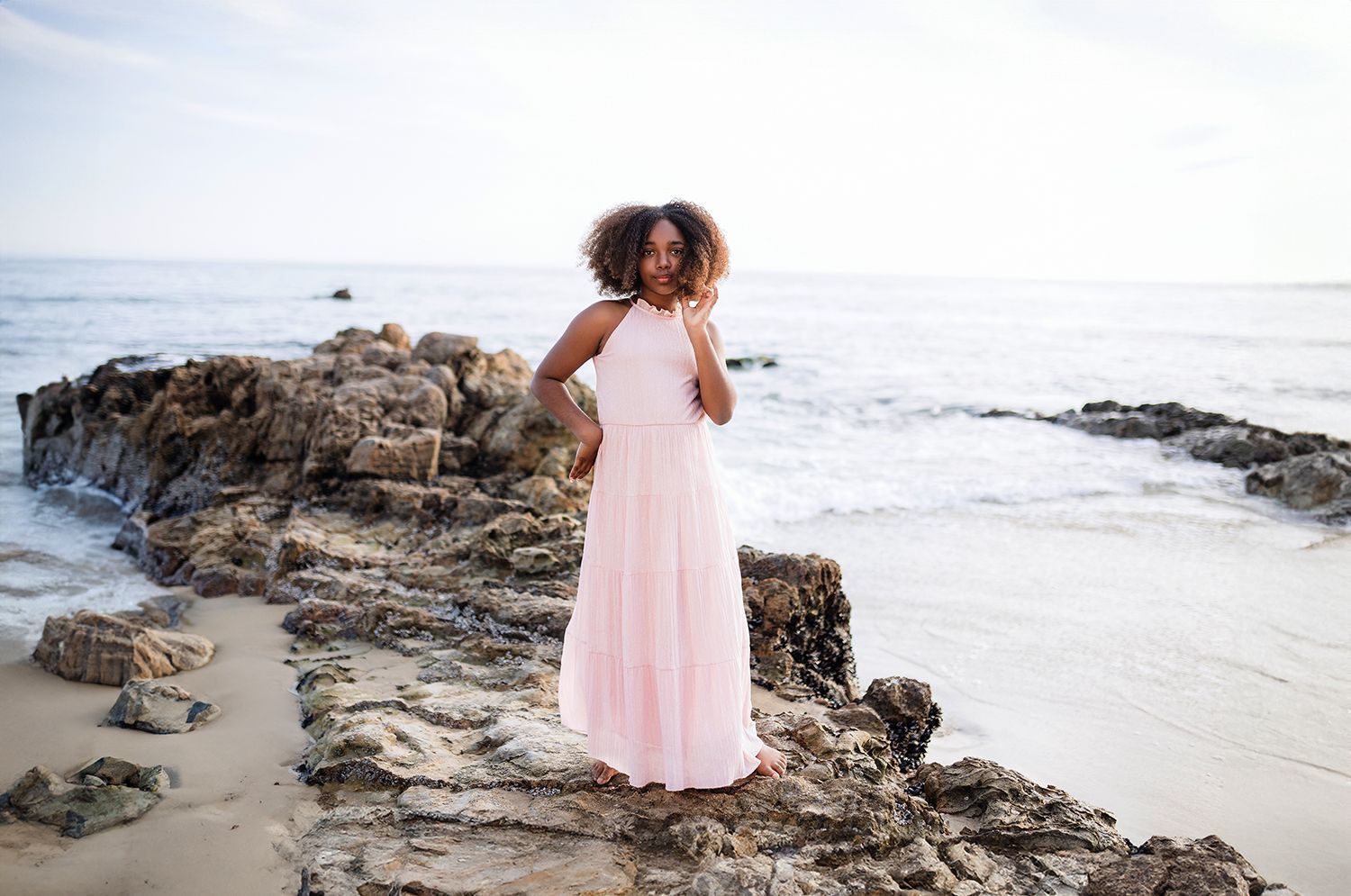 Child playing on the sand during a Laguna Beach family photography session