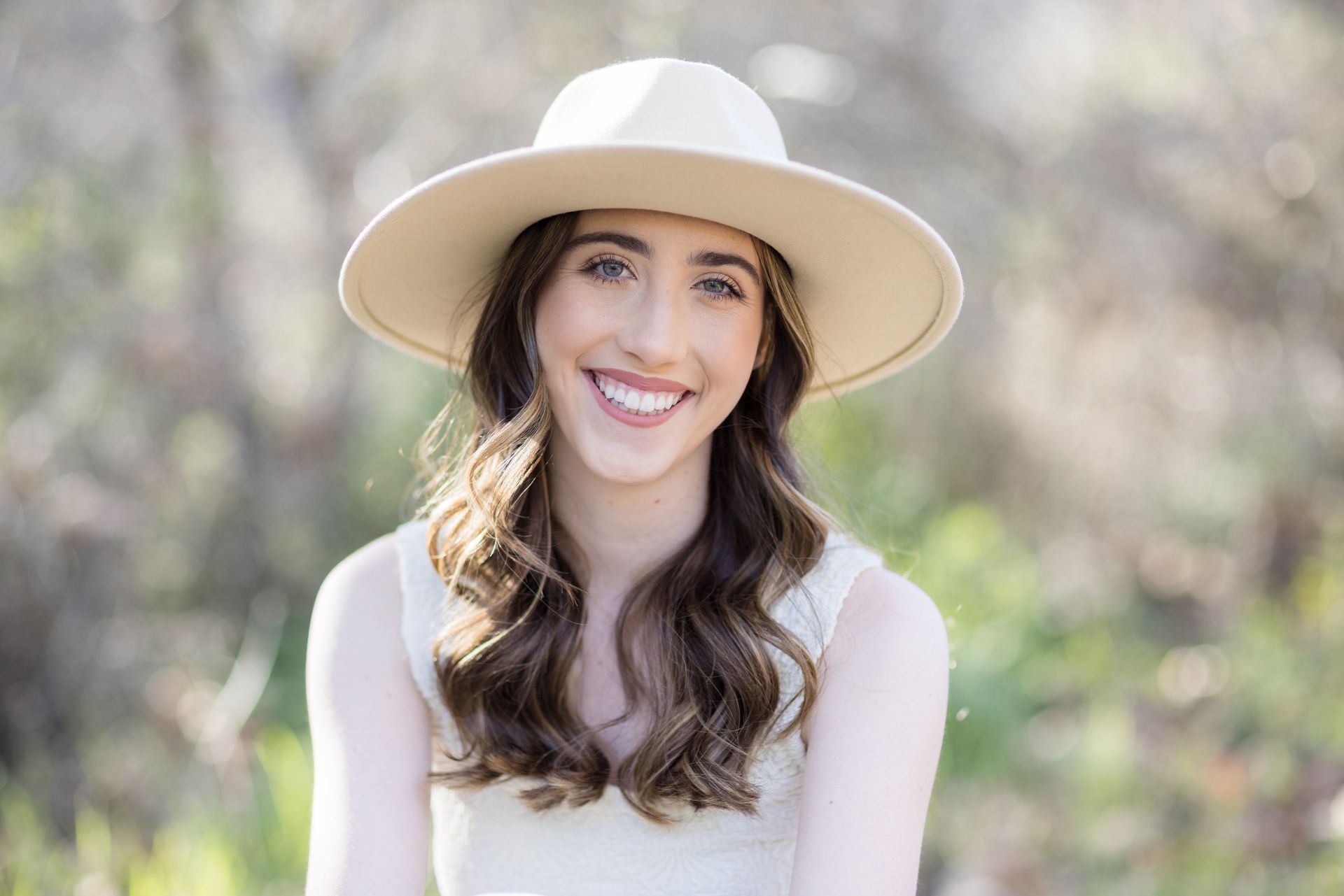 Senior girl in a wide-brim hat in Laguna Beach