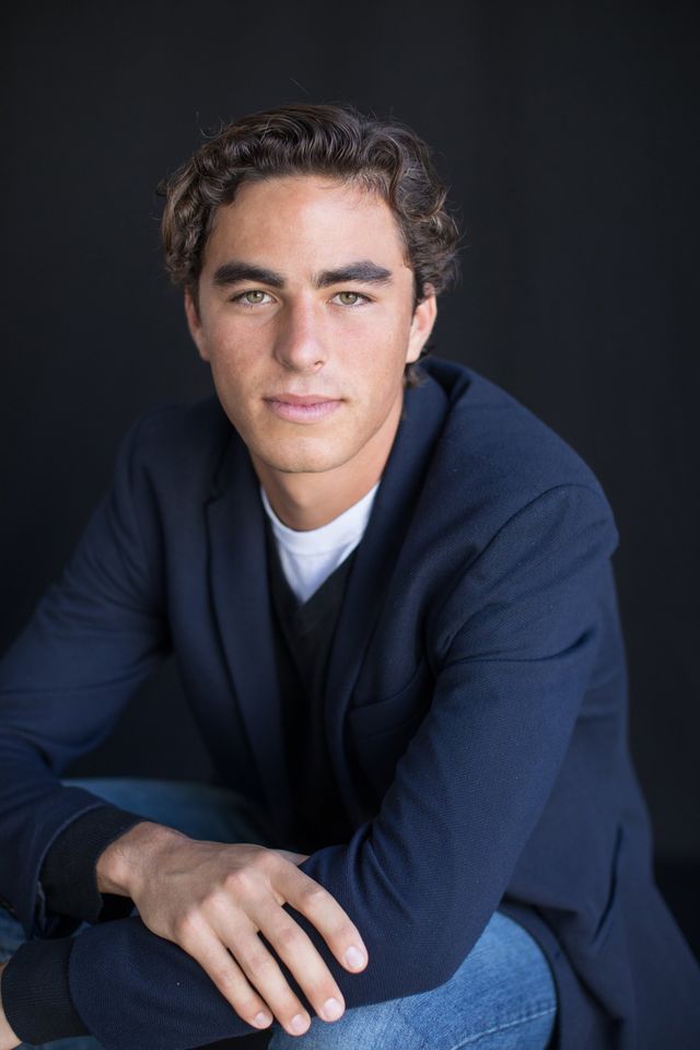 Senior guy in a navy jacket in the studio, our Laguna Beach studio