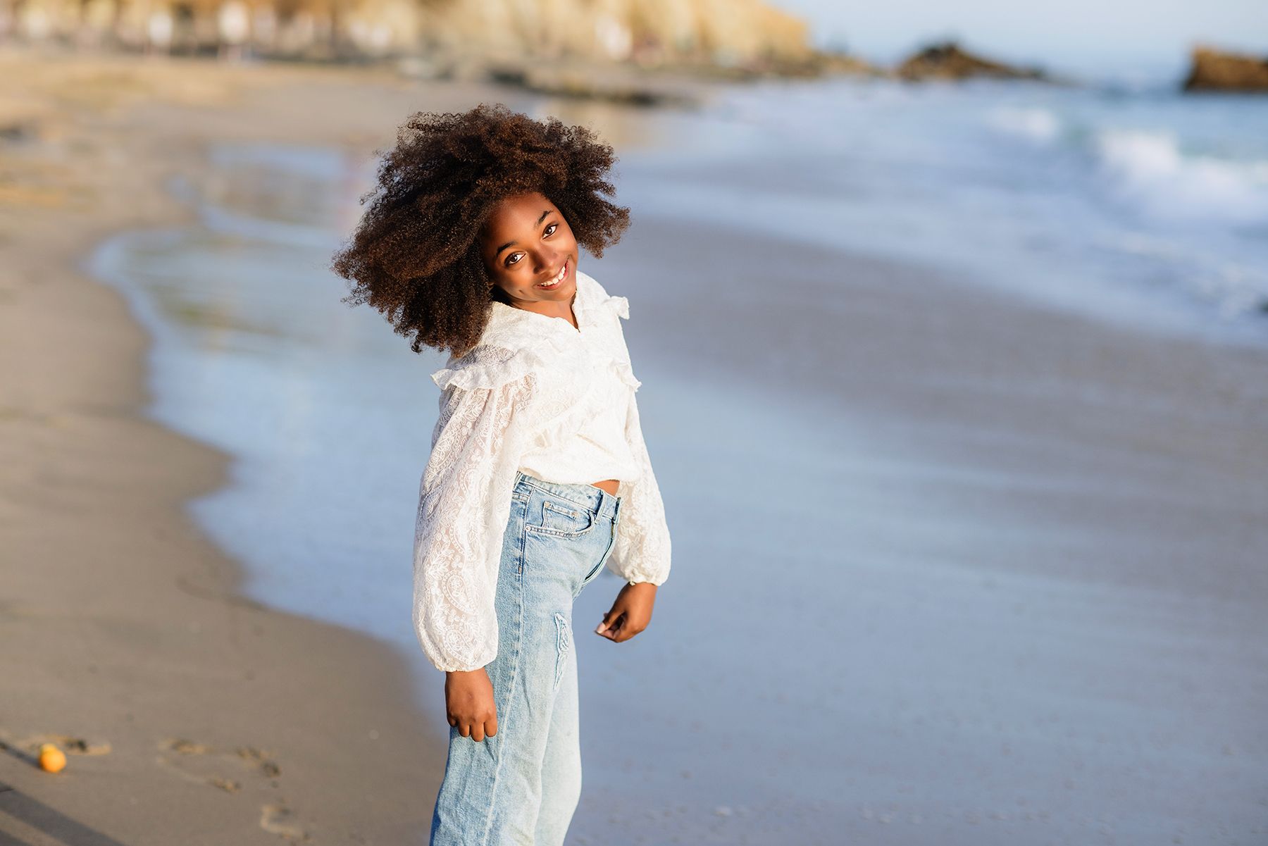 Styled children's portrait photographed on the sand in Laguna Beach