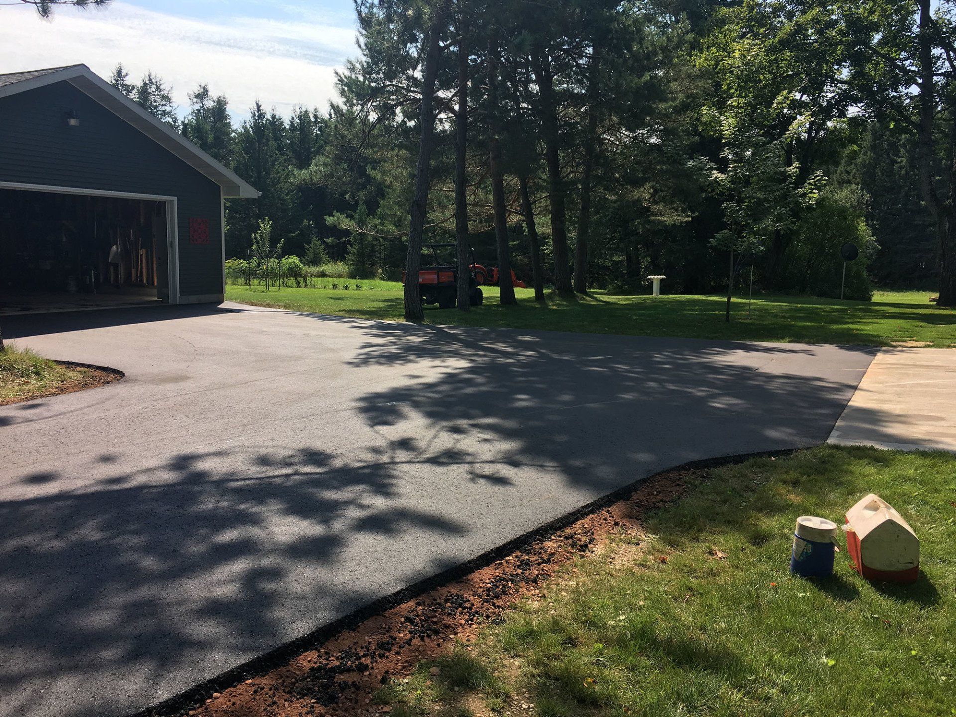 A driveway is being built in front of a house.