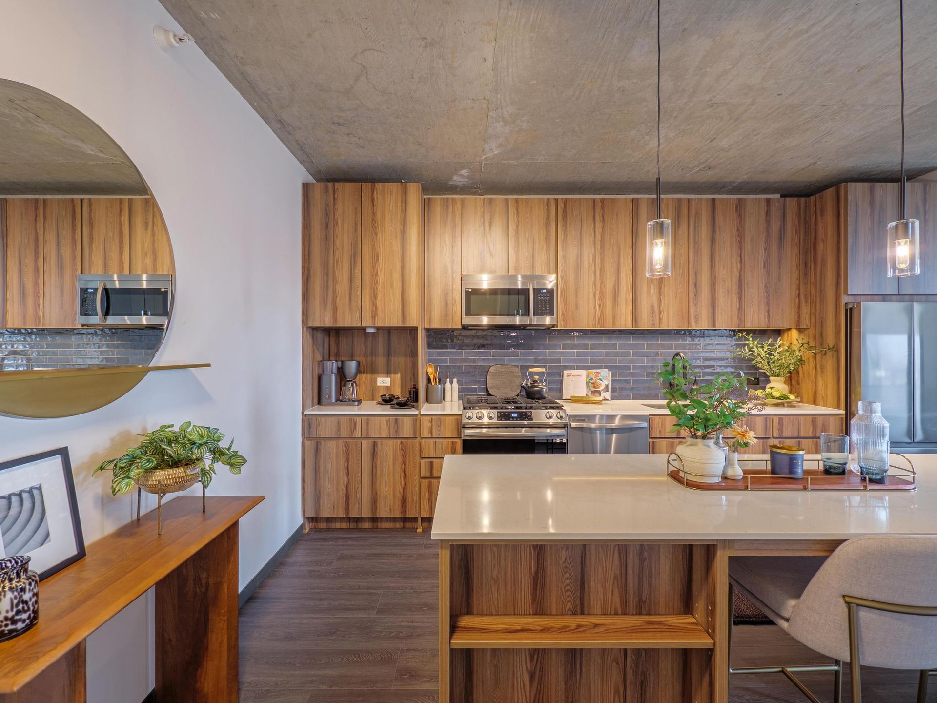 luxury kitchen featuring wood cabinetry and a large island in a Fulton Market apartment home