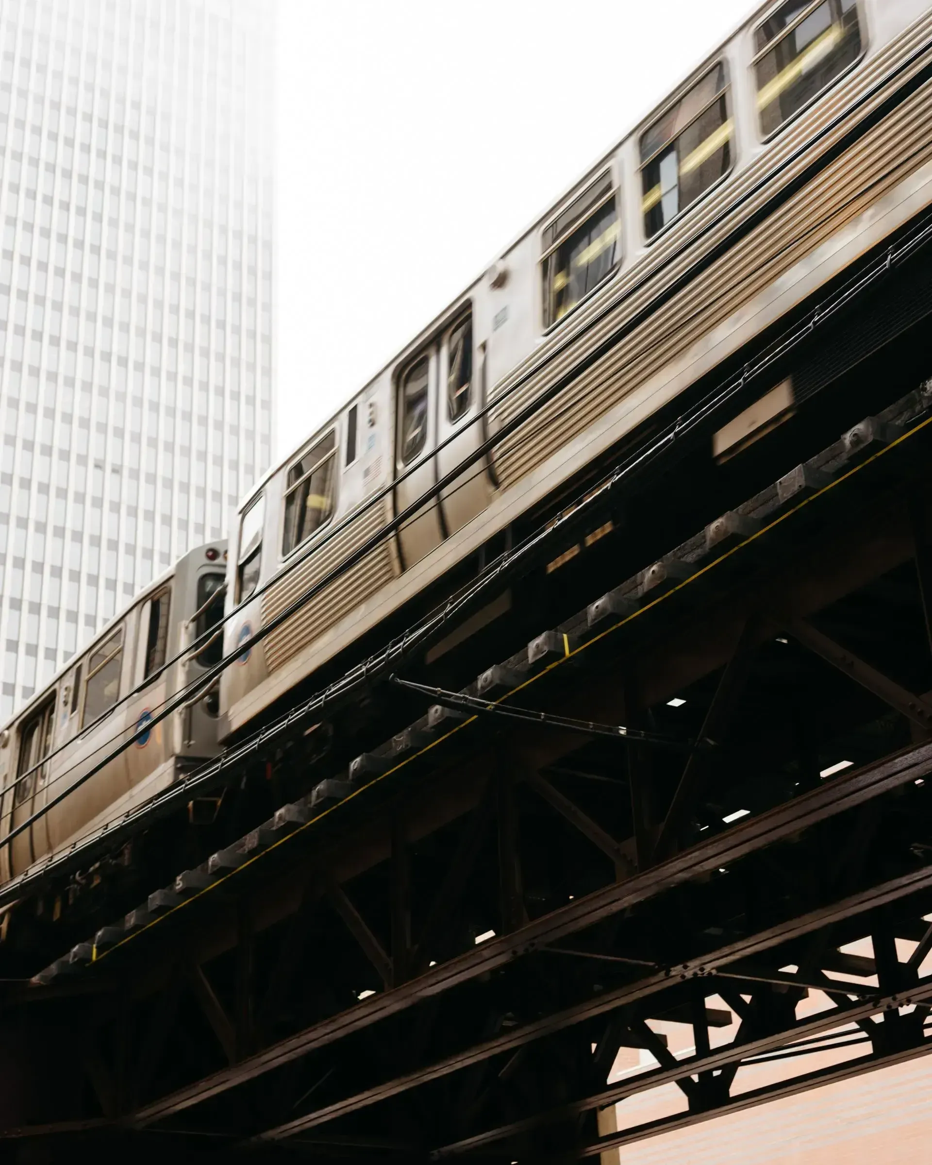 A train going over a bridge with the number 21 on the side