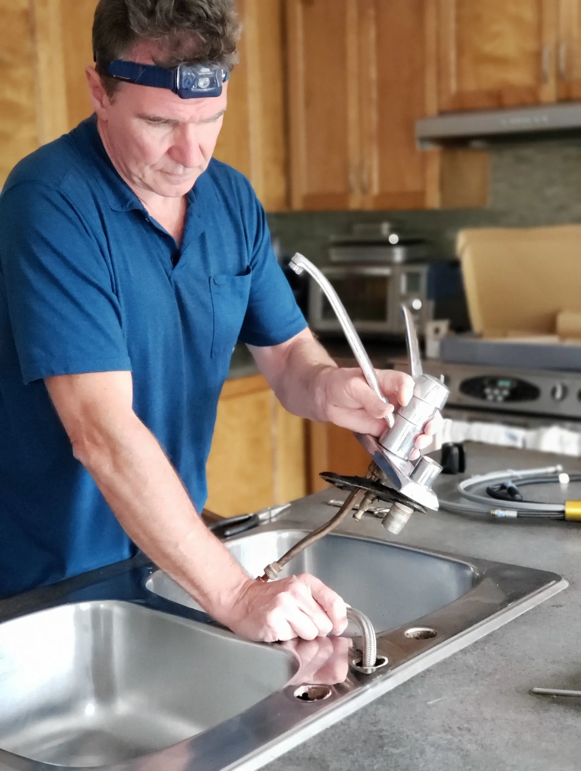 Repairing residential plumbing for EDM Home Services