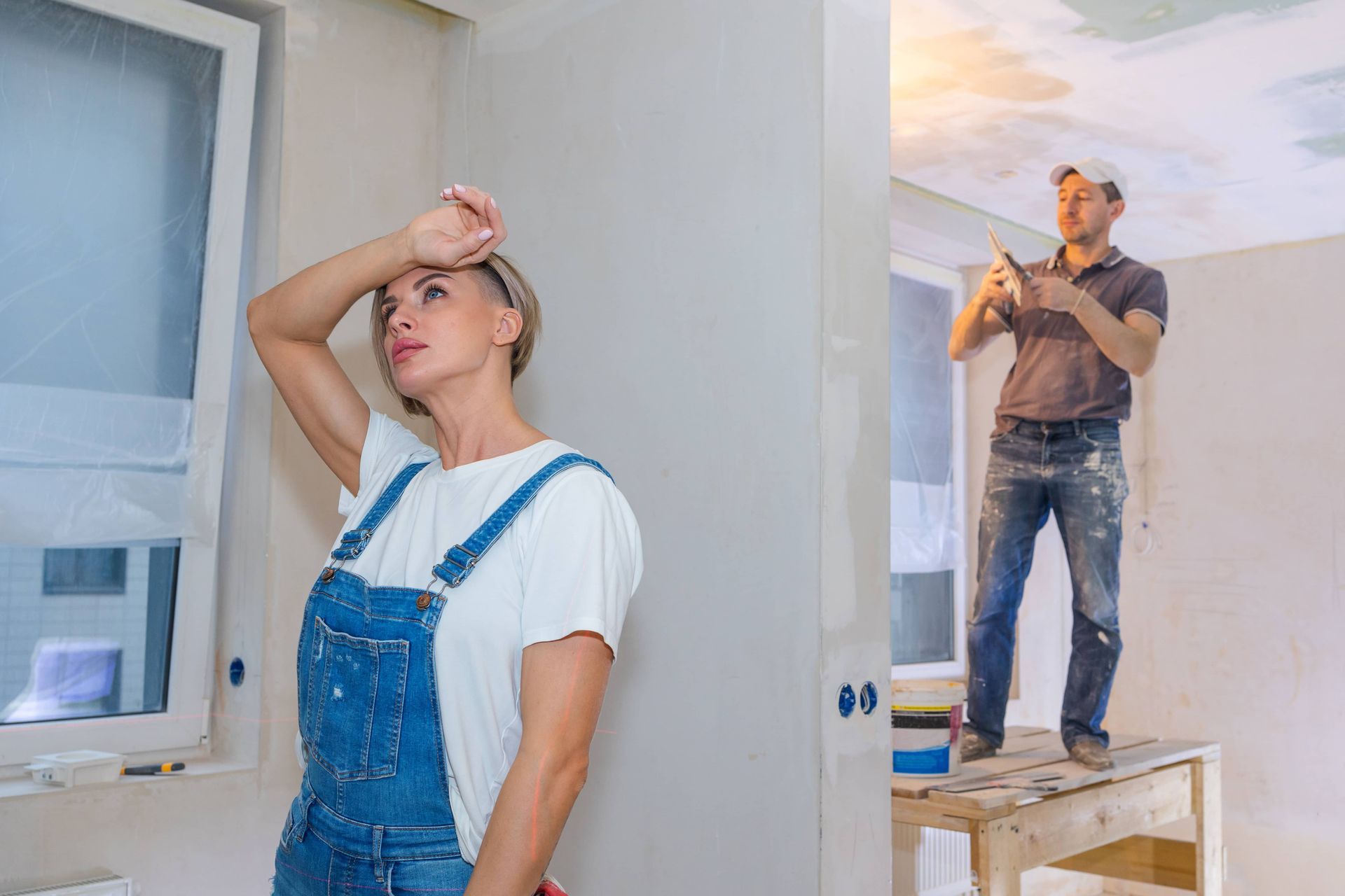 Workers making repairs in new apartment for EDM Home Services