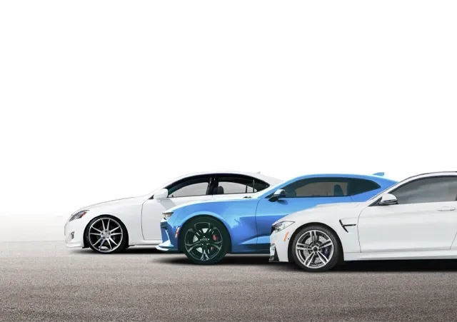 Two white cars and one blue car parked on cement with white background | Hometown Tire & Service